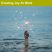 Load image into Gallery viewer, Creating Joy at Work title image. Hand holding a sparkler, sticking out of a large pool of water.
